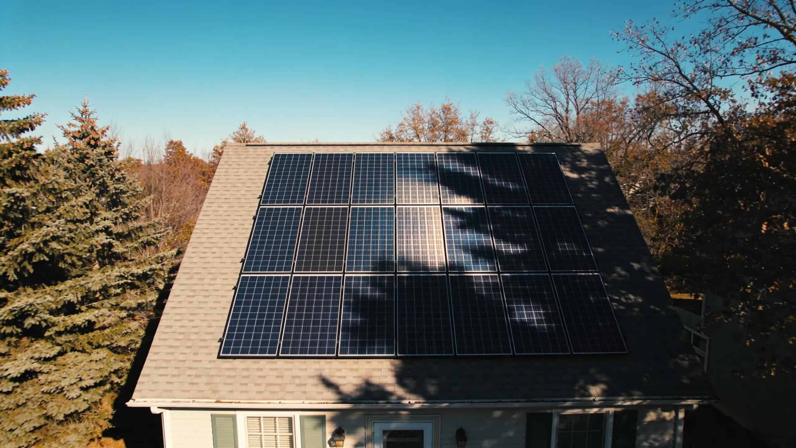 Solar panels under partial shading from trees, showing the effects of shading on energy output